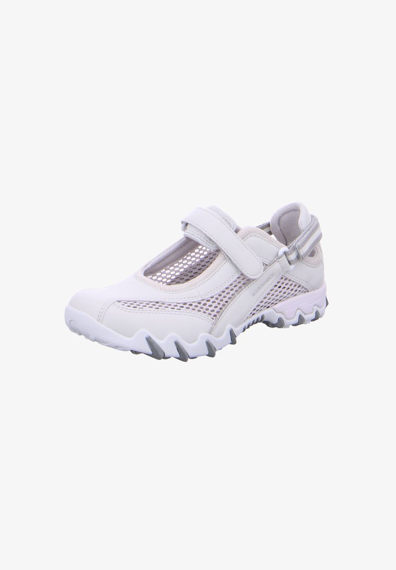 White athletic shoe with mesh panels, Velcro strap, and textured sole. Features a rounded toe and contrasting gray accents on the sole.