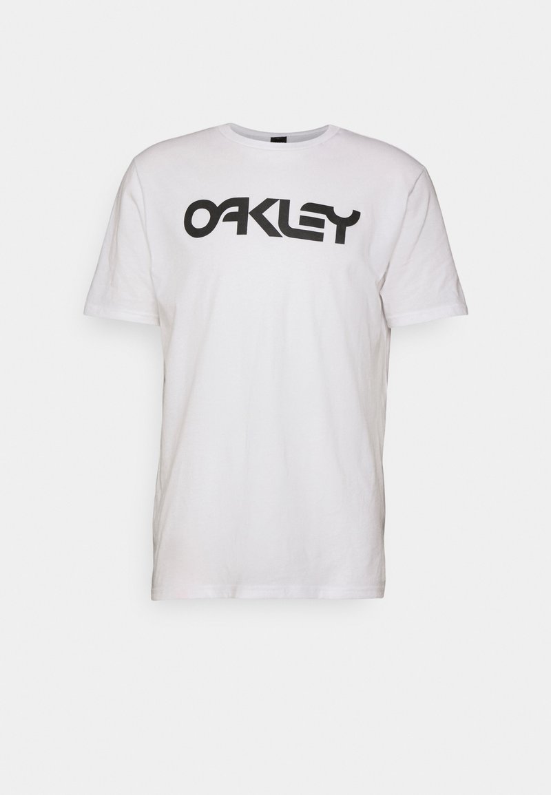 Camiseta blanca de algodón con el logo negro de "OAKLEY". Diseño de manga corta y cuello redondo con una textura suave.