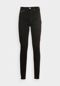 Jeans ajustados negros de mezclilla con cintura alta, con cierre de botón y cinco bolsillos. Textura suave con costuras de contraste.