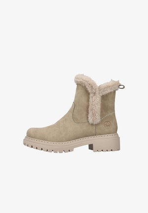 Beige Wildleder Stiefelette mit Kunstfellbesatz. Flache beige Gummisohle, genähte Details und eine Schlaufe auf der Rückseite für ein einfaches Anziehen.