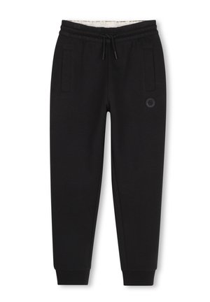 Pantalon de jogging noir fuselé avec taille élastique et cordon, poches latérales, chevilles resserrées et petit logo circulaire sur la cuisse droite.