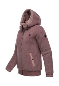 Veste en polaire couleur rose poussiéreux. Dotée d'une capuche, d'une fermeture éclair sur le devant et de deux poches latérales avec des boutons-pression. Poignets et ourlet côtelés. Texture douce.