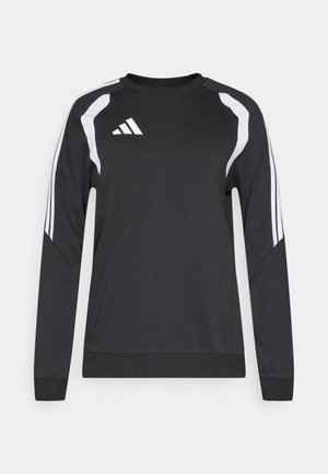 Czarna bluza z długimi rękawami, białe ukośne paski na ramionach oraz biały logo Adidas na górnej lewej stronie klatki piersiowej. Miękka tekstura.