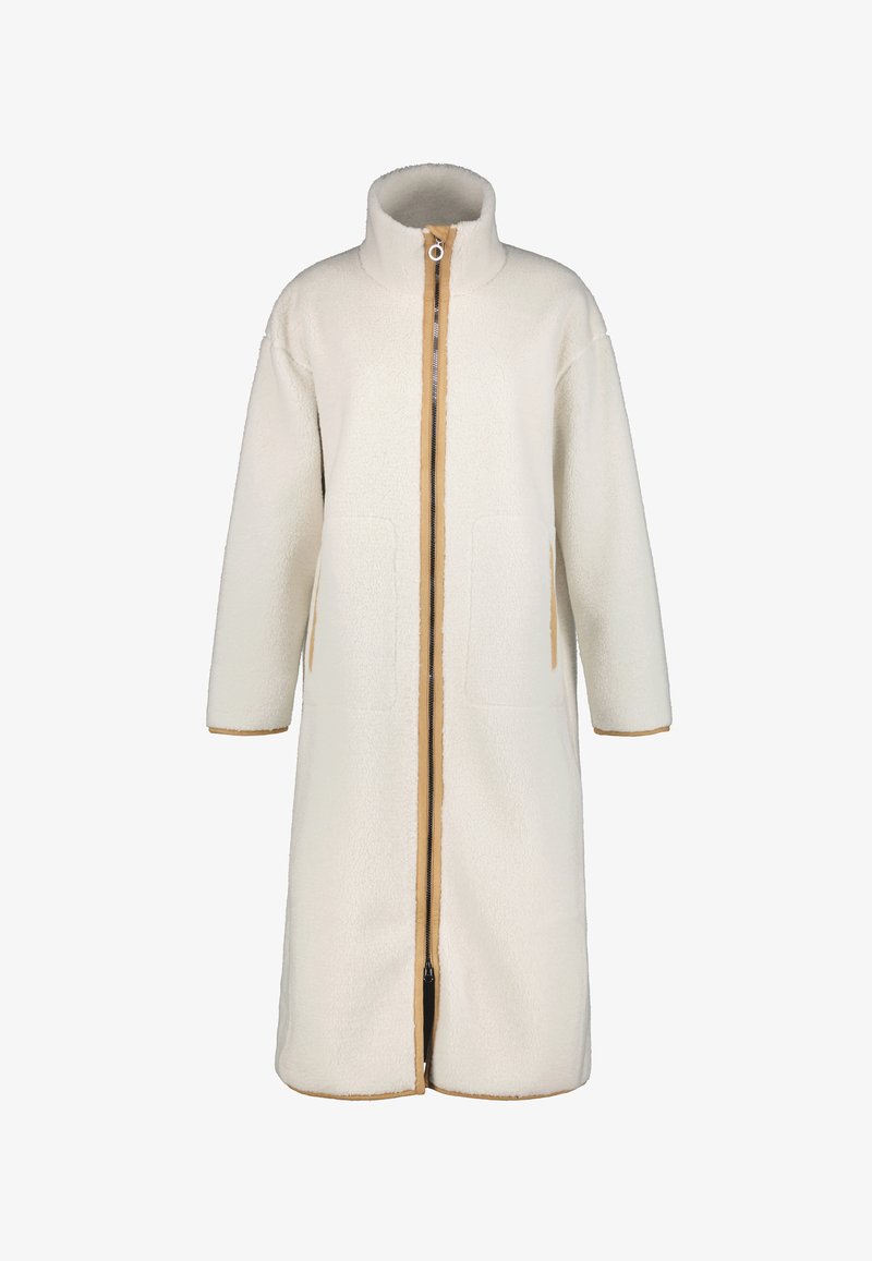 Lang, crèmekleurige jas van textuur fleece, met een hoge kraag, een ritssluiting aan de voorkant en twee grote zakken met bruine accenten.