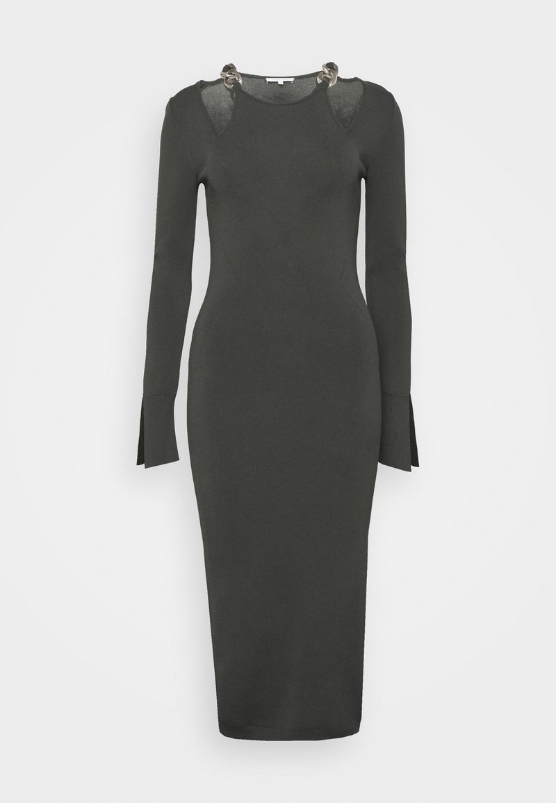 Ciemnozielona, dopasowana sukienka z długim rękawem, wykonana z dzianiny, z wycięciami na ramionach i srebrnymi ozdobami przy dekolcie.