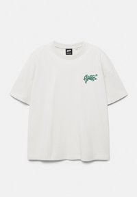 White short-sleeve crewneck t-shirt with small green graffiti-style text and star logo on the left chest.