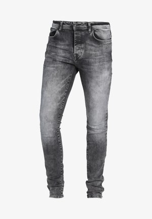 Slim-fit jeans in versleten zwarte denim met een vervaagde textuur. Bevat vijf zakken, riemlussen en een knoopsluiting in de taille.