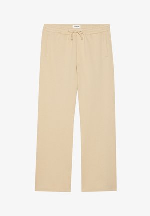 Beige wide-leg pants made of soft fabric, featuring an elastic waistband with a drawstring and two side pockets. Smooth texture.