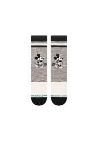 Graue Socken mit schwarz-weißen Streifen, die eine Cartoonfigur in Laufpose zeigen. Bequemes Strickmaterial mit verstärktem Zehenbereich.