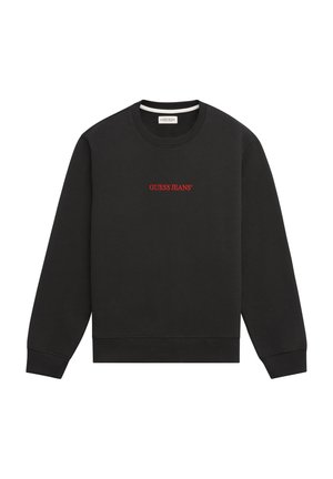 Melnā džemperī ar ribotām piedurknēm un apakšmalu, ar apaļu kakla izgriezumu. Uz priekšpuses ir sarkans izšūts logotips "GUESS JEANS". Mīksta tekstūra.