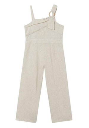 Combinaison large en lin beige avec encolure asymétrique, une bretelle fine et une bretelle large avec détail de boucle circulaire.
