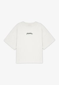 Krämfärgad t-shirt med kort ärm i bomull, med rund halsringning och en liten grön "pegador"-logotyp centrerad på bröstet.