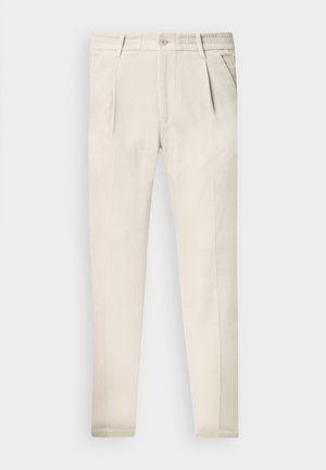 Beige, schmal geschnittene Hose aus leichtem Material. Verfügt über vordere Falten, seitliche Taschen und einen klassischen Knopfverschluss.