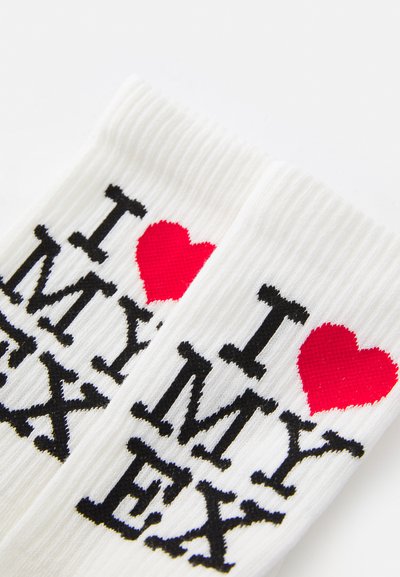 White ribbed socks featuring black text "I MY EX" and a red heart. Material is soft, cotton-blend with a casual design.