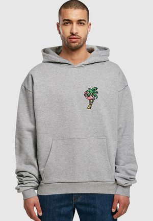 Gray hoodie made of soft fabric, featuring a front kangaroo pocket and a colorful palm tree and flamingo embroidery on the chest.