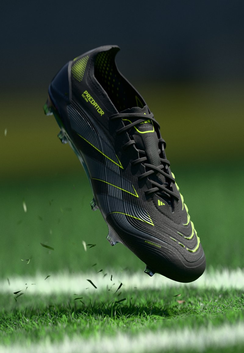 Black soccer shoe with neon green accents, featuring a textured upper, sleek design, and cleats for traction on grass surfaces.