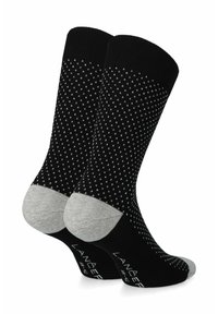 Czarne skarpetki z geometrycznym wzorem białych kropek. Posiadają szary nosek i piętę. Wykonane z miękkiego, elastycznego materiału.