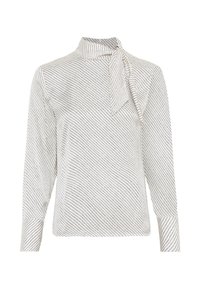 Vit blus med lång ärm och en rosett vid kragen. Har ett diagonalt svart mönster över hela blusen och strukturerade manschetter.