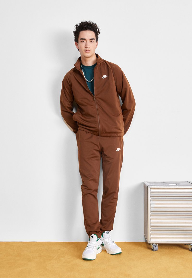 brown and white nike tracksuit