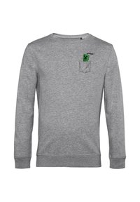 Szara bluza z długimi rękawami, okrągłym dekoltem, z zielonym pikselowym wzorem postaci w okolicy kieszeni oraz subtelnymi detalami przeszycia.