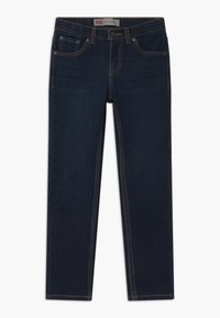 Jeans de mezclilla azul oscuro con corte ajustado, que cuentan con cinco bolsillos, costuras en contraste y cierre de botón. Lavables a máquina, diseño de pierna recta.