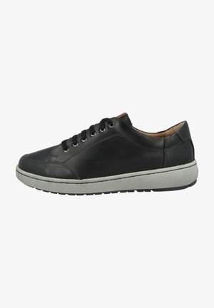 Black leather sneaker with circular toe, tonal stitching, gray rubber sole, and lace-up design featuring six eyelets and brown accents.
