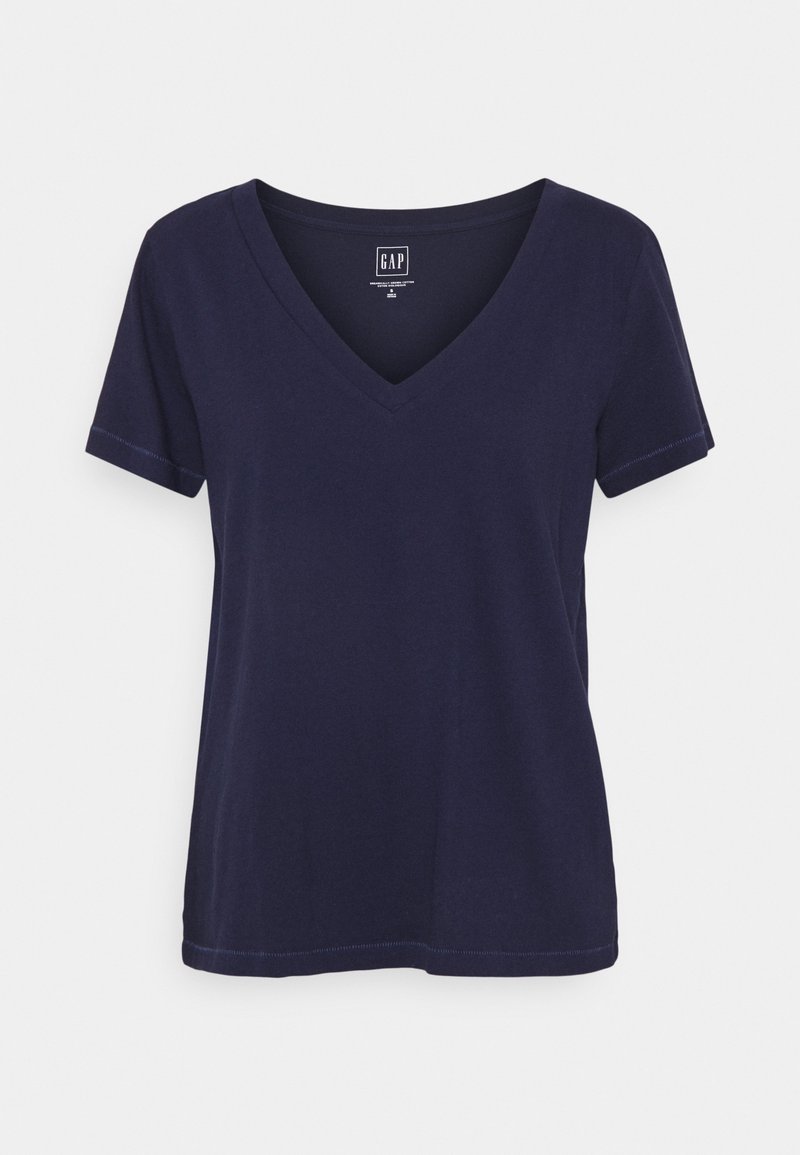 T-shirt bleu marine foncé uni à manches courtes, col en V, coutures visibles et étiquette de marque GAP sur le col intérieur.