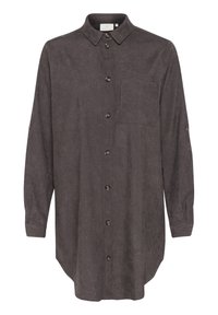 Brun skjorte med knapper, lange ærmer, krave, forlommer og tekstureret stof. Knapper ned foran, og ærmerne er rullet op.