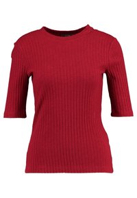 Červené pruhované tričko s krátkým rukávem a kulatým výstřihem. Vyrobeno z texturované látky, má slim fit střih a jemný elastický materiál pro pohodlí.