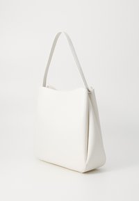 White leather shoulder bag with a minimalist design, featuring a smooth texture and a single strap. No visible hardware details.