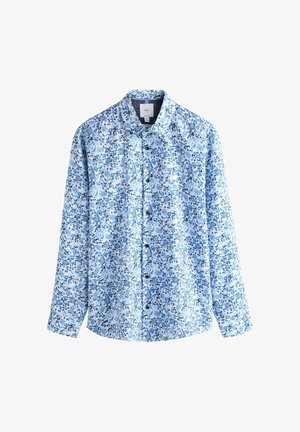 Camicia a maniche lunghe con bottoni, di colore azzurro chiaro, con motivo floreale in varie tonalità di blu. Tessuto in cotone con colletto classico.