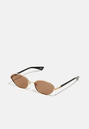 Oval sunglasses with brown lenses, gold metal frame, and black plastic arms. Features thin detailing and rounded edges.