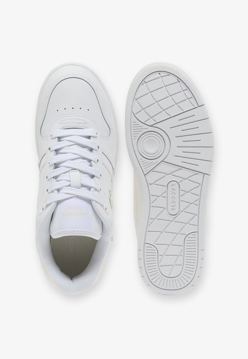 White low-top sneaker with laces shown from top view and sole with textured grip and Lacoste logo in center.