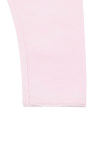 Lichtroze katoenen legging met een gladde textuur, aansluitend ontwerp en keurig gestikte zoom. Geen extra patronen of hardware.