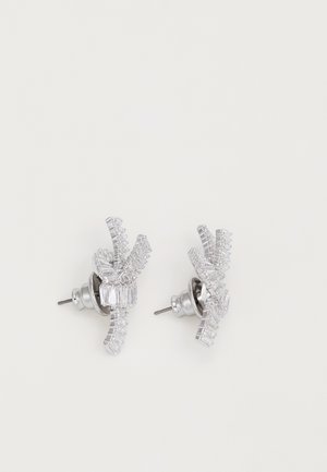 Silver earrings featuring a geometric design, with alternating baguette and round clear crystal accents arranged in a 3D formation.