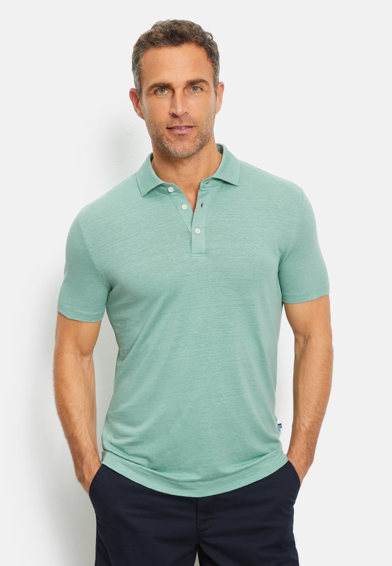 Poloshirt mit kurzen Ärmeln in Hellgrün, aus strukturiertem Stoff. Verfügt über eine Dreiknopf-Leiste und einen leicht lockeren Schnitt.
