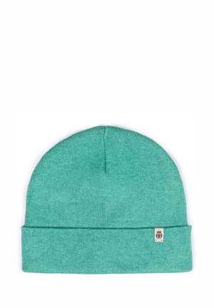 Knit beanie in teal color with a fold-over cuff. Features a small logo tag on the side. Soft texture and rounded shape.