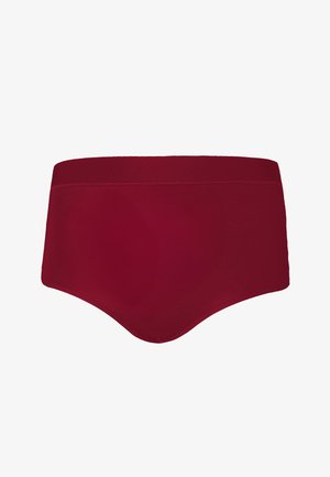 Red, high-waisted brief made from smooth fabric. Features a wide waistband and seamless edges for comfort. Solid color with no patterns.