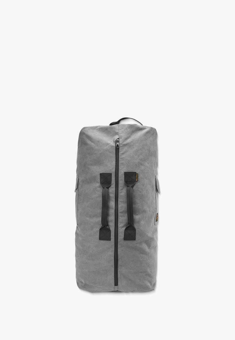 Gray canvas backpack with a zip closure, two black straps, and side pockets. Features a textured fabric and a top handle for carrying.