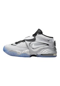 White and silver athletic shoes with a black strap, featuring a textured finish, a translucent blue sole, and a large side logo.