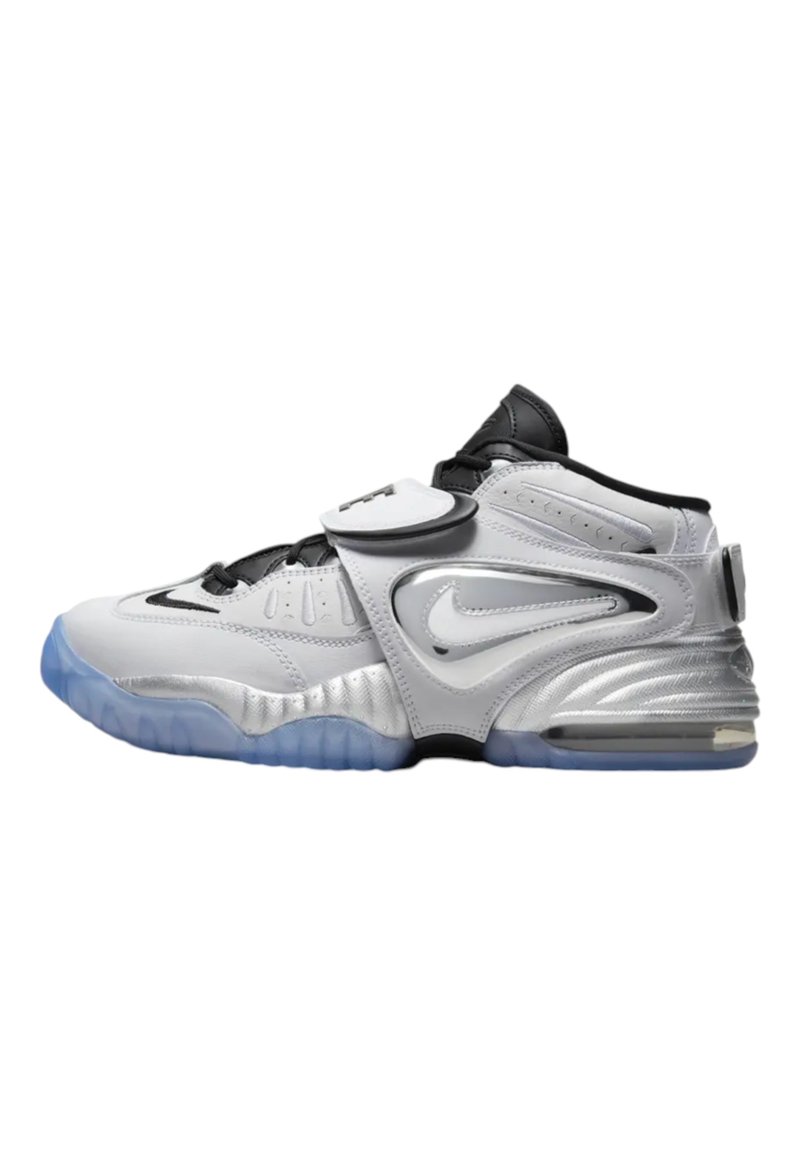 White and silver athletic shoes with a black strap, featuring a textured finish, a translucent blue sole, and a large side logo.