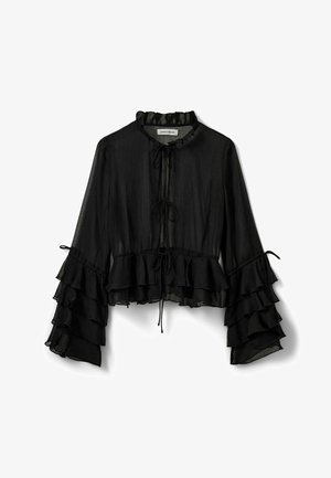 Melnas caurspīdīgas blūzes ar viļņotām garām piedurknēm, augstu apkakli un saišu aizdari priekšpusē. Viegls audums ar plūstošu dizainu.