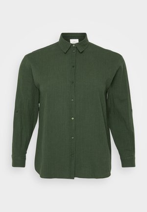 Green long-sleeve shirt featuring a button-down front, textured fabric, and a classic collar. Roll-up sleeves with button tabs add versatility.