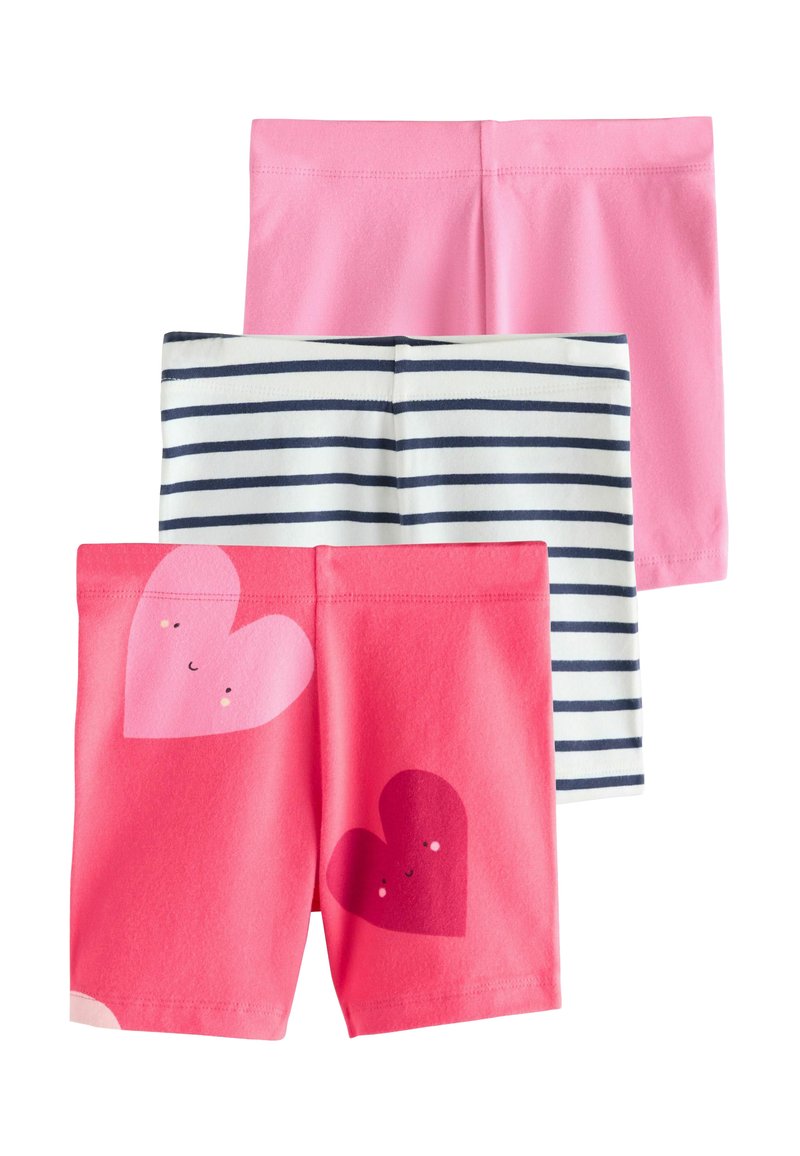Three pairs of shorts: solid pink, striped navy and white, and coral with heart designs. Soft fabric, elastic waistbands, playful patterns.
