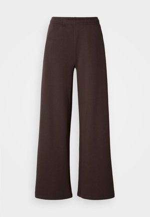Φαρδιά παντελόνια σε σκούρο καφέ, φτιαγμένα από μαλακό ύφασμα με ελαστική μέση και καθαρό φινίρισμα στο τελείωμα, ιδανικά για άνεση και καθημερινή χρήση.