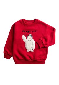 Sudadera roja con un diseño de yeti blanco esponjoso y un sombrero azul, texto bordado "READY YETI" y puños y cuello acanalados.