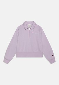 Levandulová zkrácená mikina se čtvrtinov�ým zipem, límečkem, žebrovanými manžetami a malým logem na hrudi a rukávu. Měkká textilie.