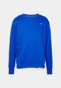 Sweat-shirt Nike à manches longues d'un bleu vif avec un petit logo Swoosh blanc sur la poitrine et des poignets et ourlet côtelés.