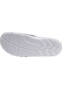 Sula till sko i vitt gummimaterial, med ett mönster för bra grepp. Slät yta och rundad form med subtil branding.