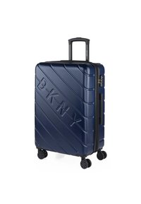 Maleta de plástico duro azul con surcos diagonales y el logo "BKNY" en relieve. Cuenta con un asa telescópica y cuatro ruedas negras para mayor movilidad.